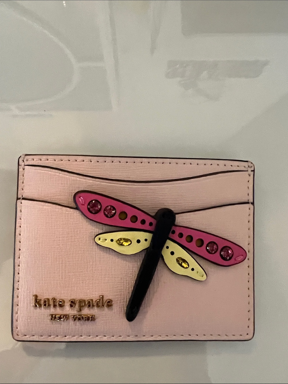 kate spade pink dragonfly card case with yellow accents